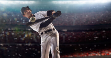 Baseball player hitting ball