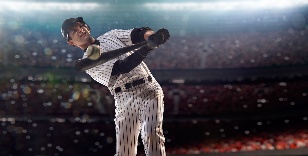 Baseball player hitting ball