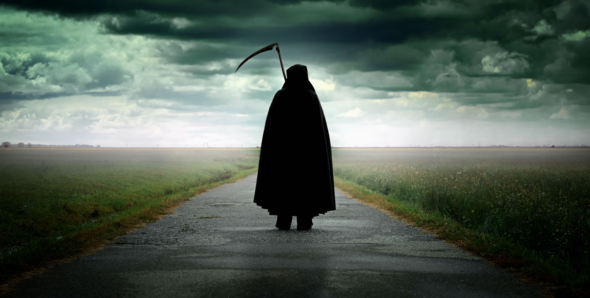 Grim reaper standing on road