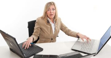 Woman overwhelmed multitasking