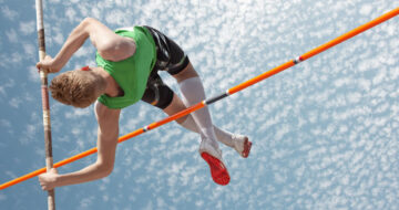 Pole vaulter clearing the bar