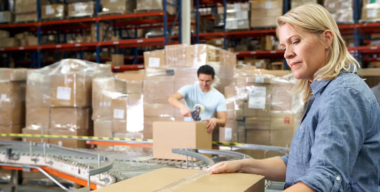 People working shipping orders in warehouse