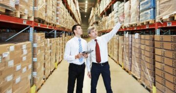 Men in wholesale warehouse sourcing products