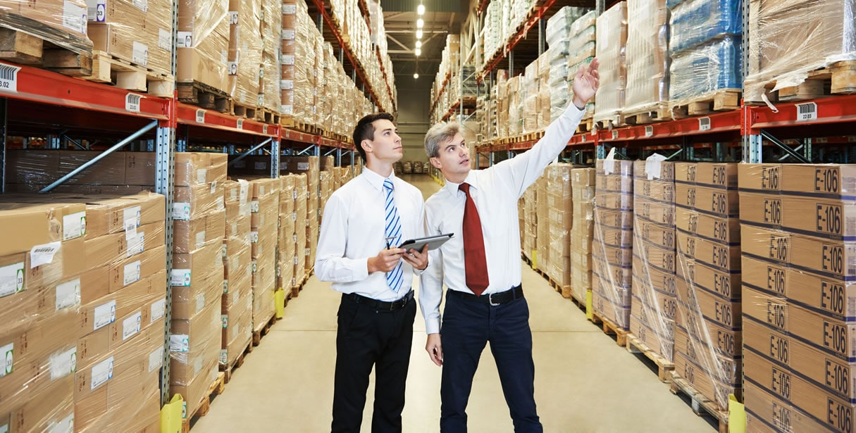 Men in wholesale warehouse sourcing products