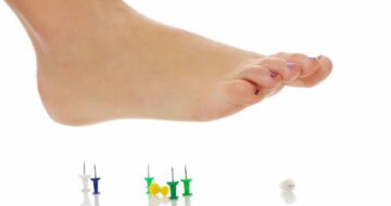 Foot about to step on tacks