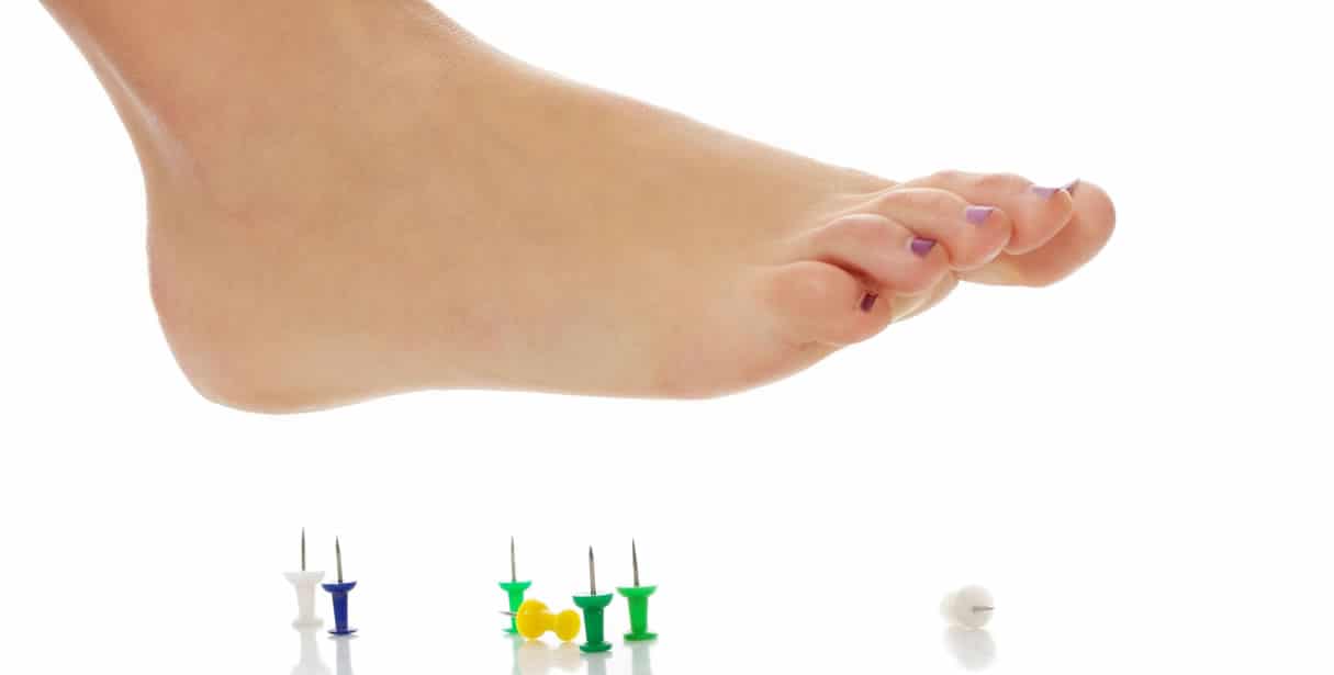 Foot about to step on tacks