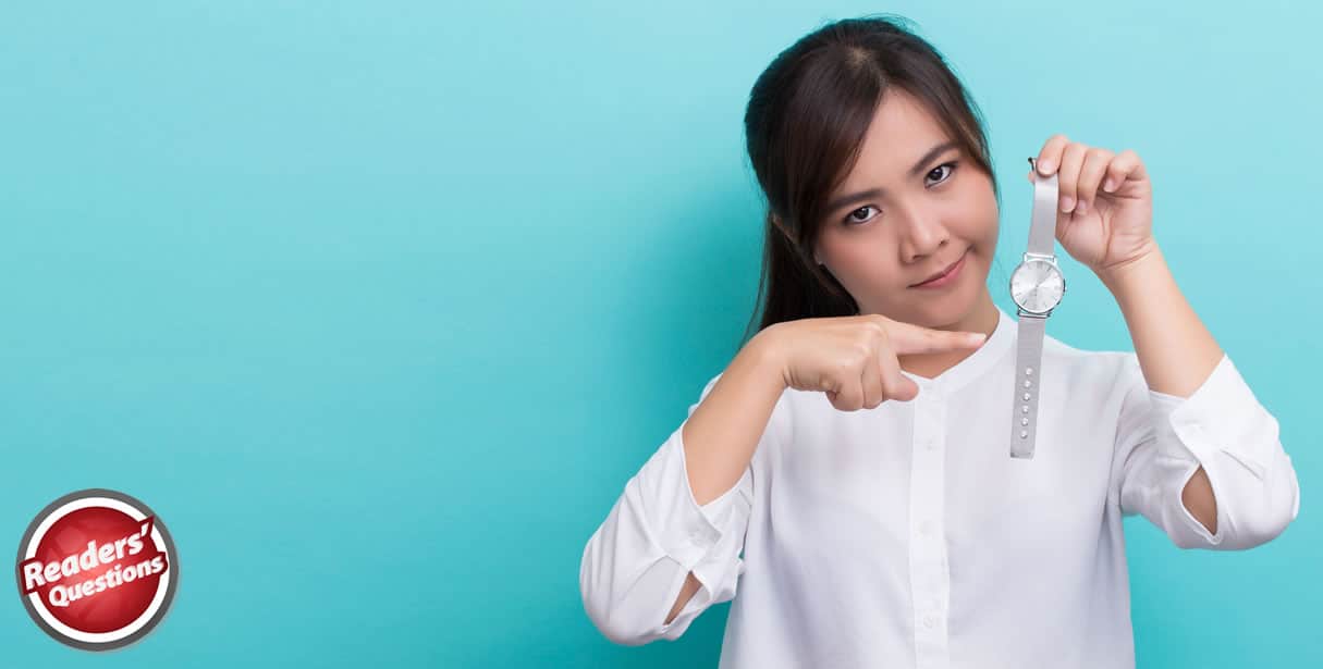 Woman pointing at watch