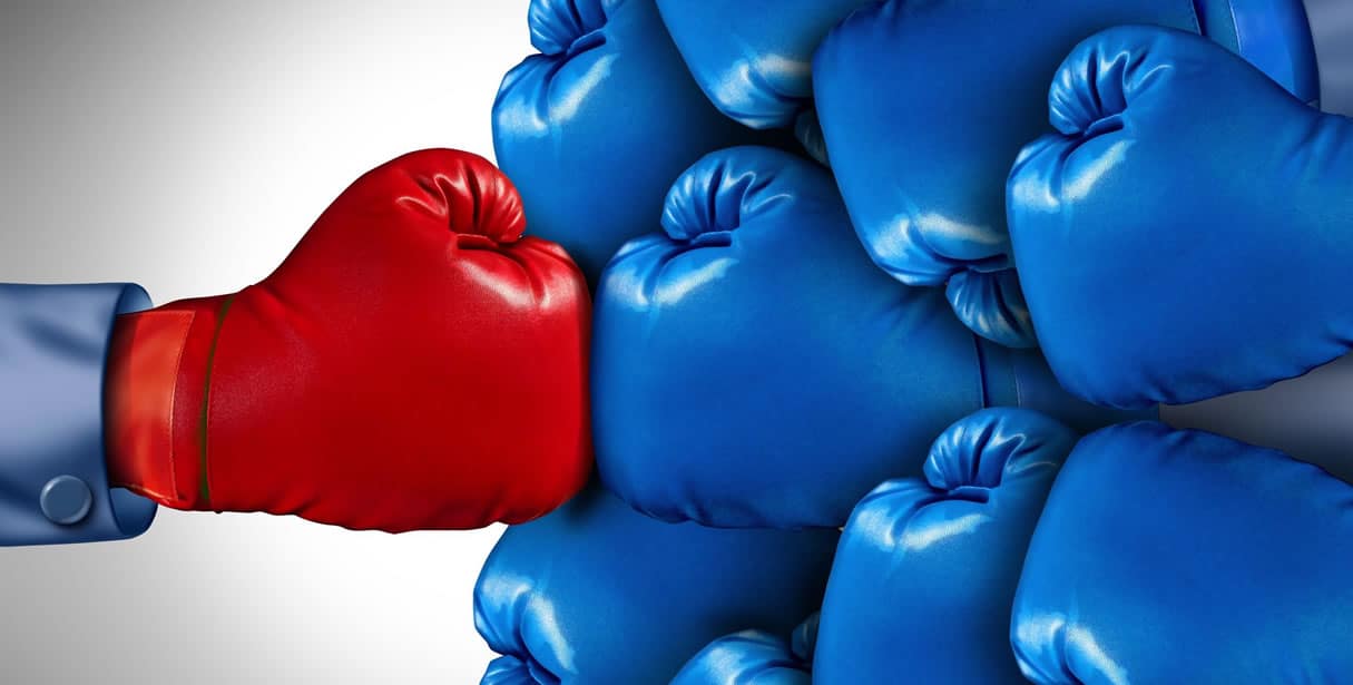 Red boxing glove vs many blue gloves
