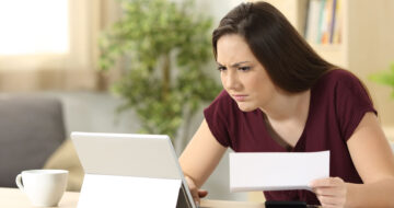 Woman frowning at computer