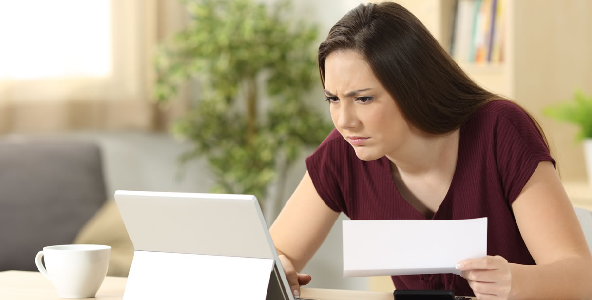 Woman frowning at computer