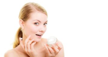 Woman applying cream representing private label skin care products