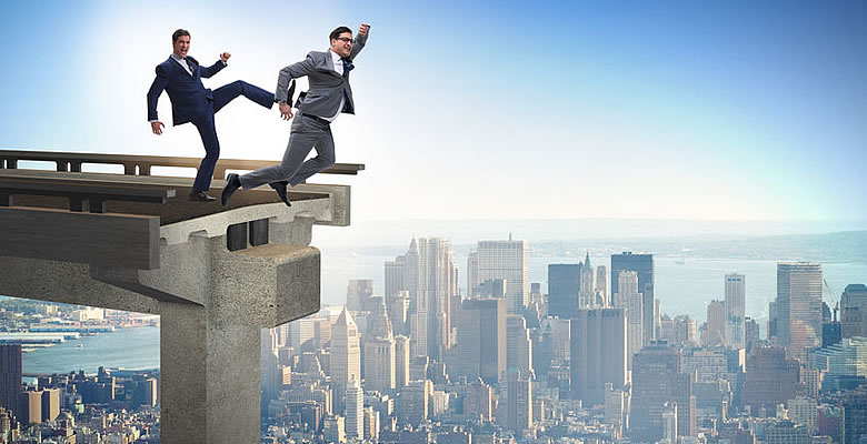 Man kicking another man off a bridge