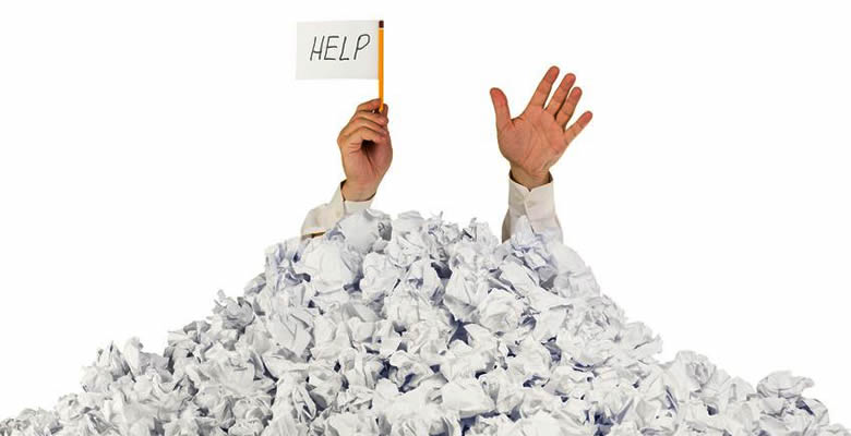 Man in paper holding up help sign