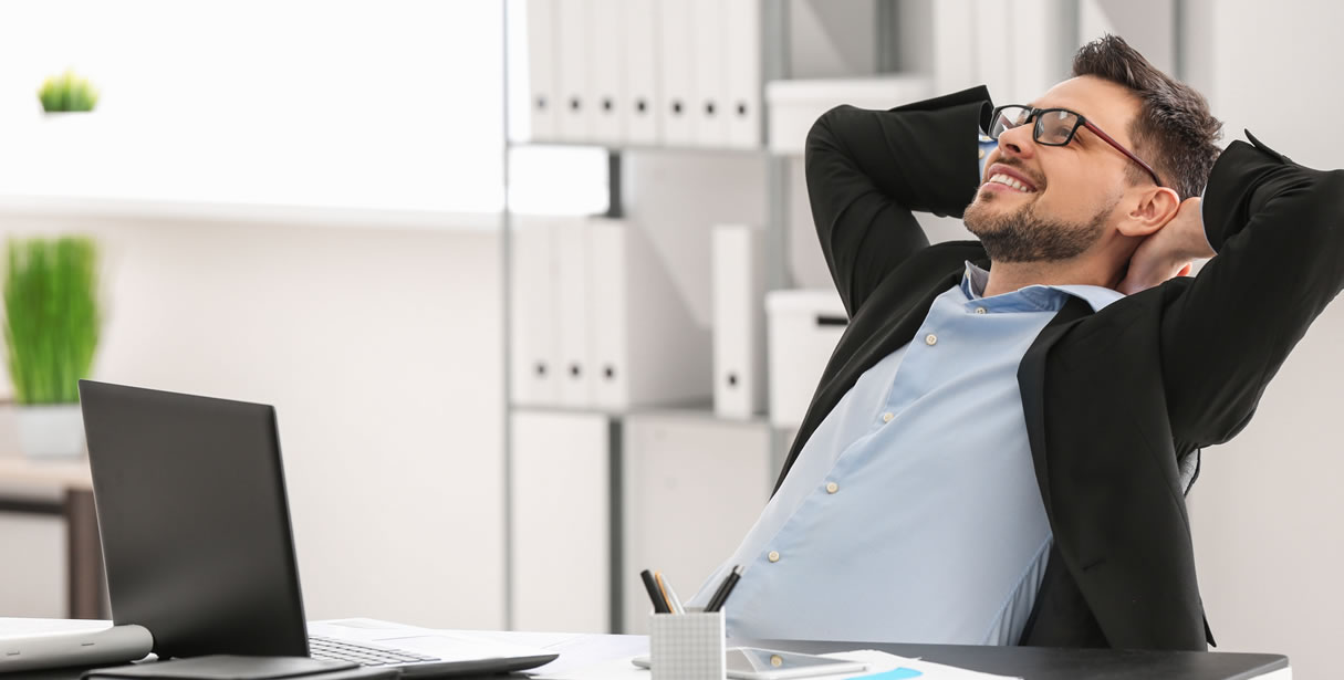 Man relaxing at desk