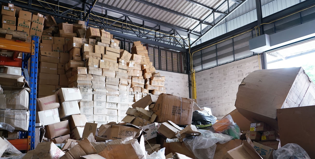 Warehouse with towers of toppling boxes