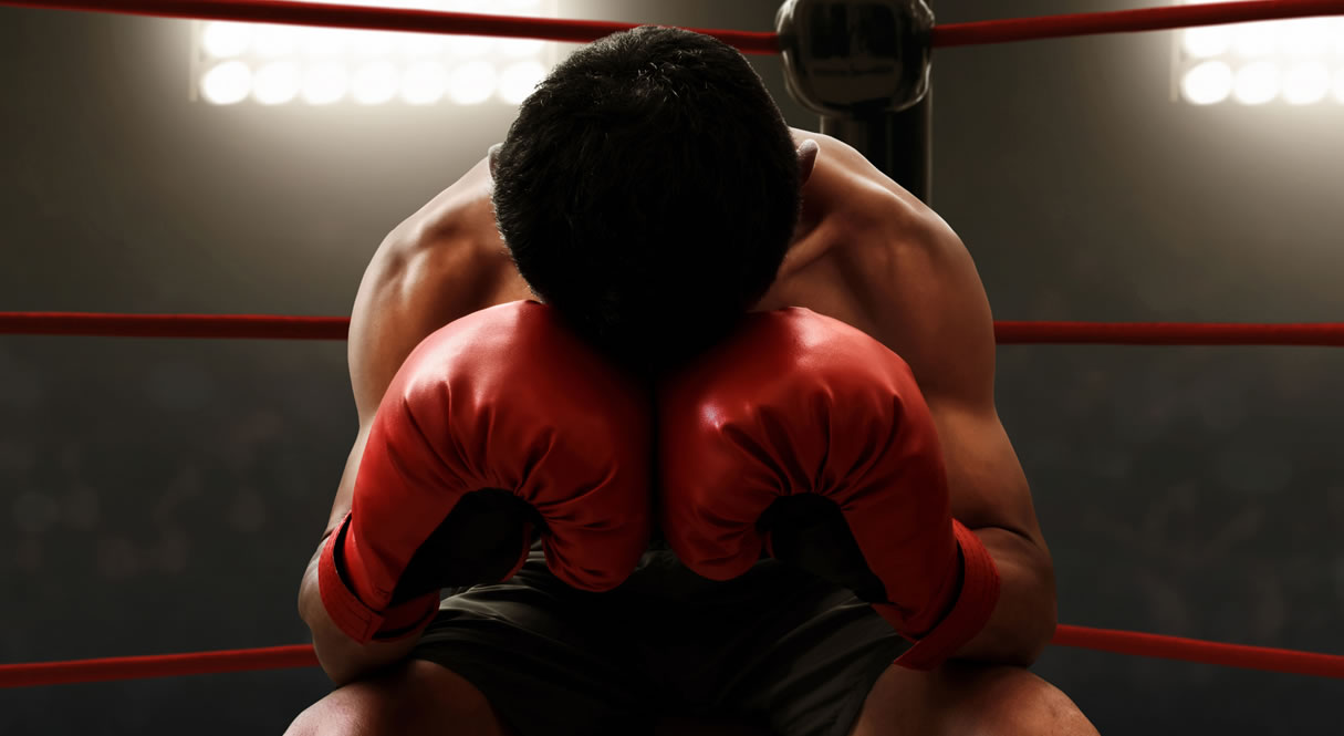Boxer tired in corner of the ring