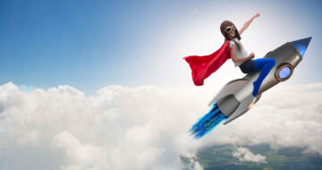 Girl riding rocket in the sky