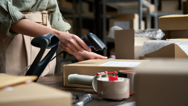 Using barcode reader at packing table in a warehouse 1