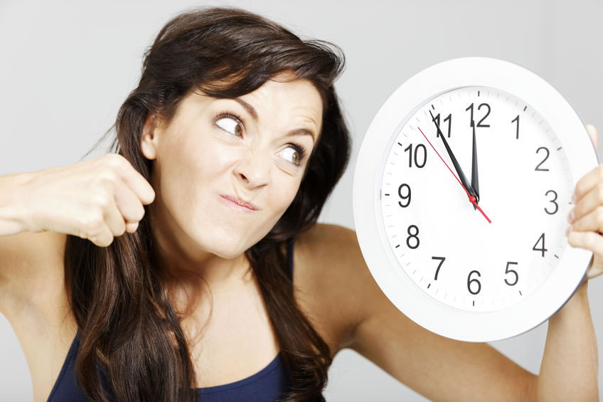 Woman about to punch clock