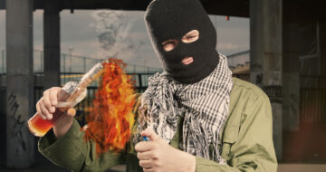 Man lighting petrol bomb
