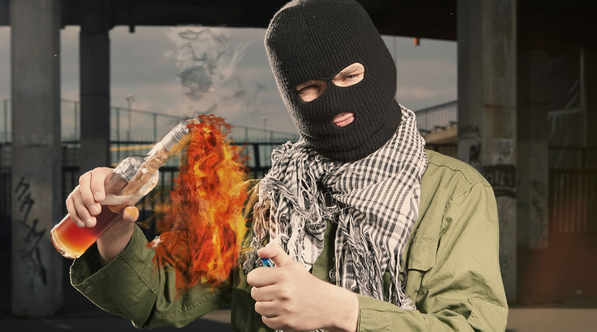 Man lighting petrol bomb
