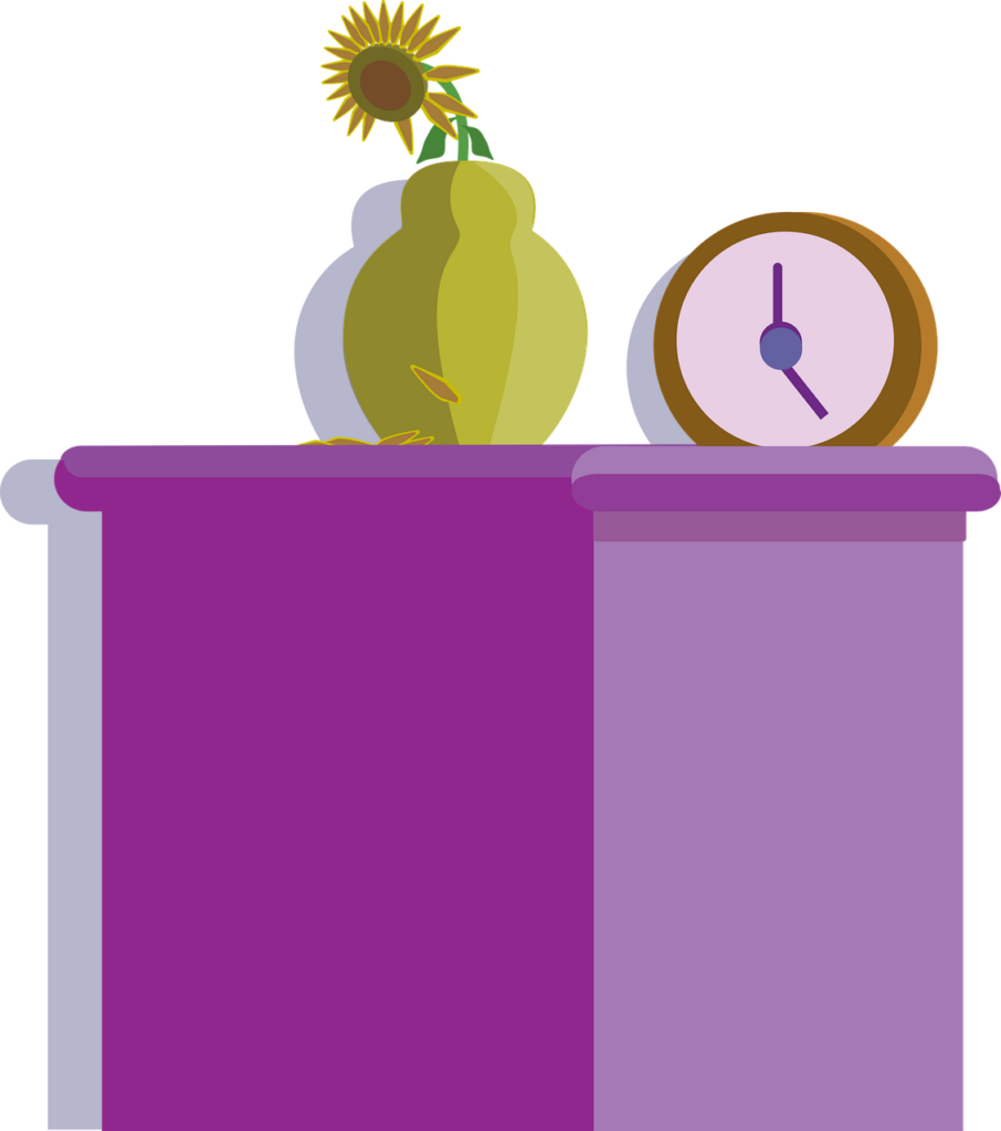 A flower and a clock on top of a furniture